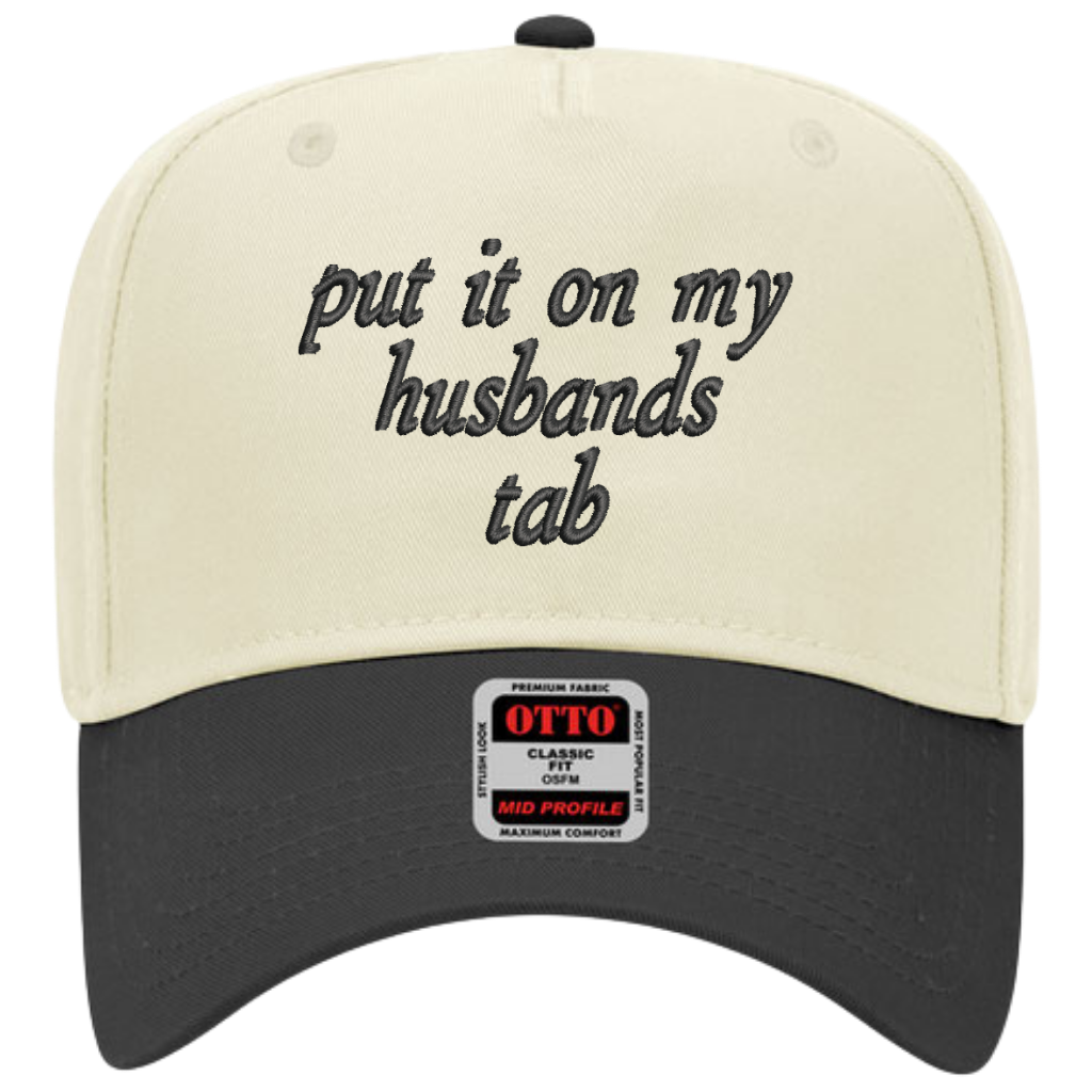 12 Put It On My Husband's Tab Embroidered Snapback Trucker Hat - Cream / Black