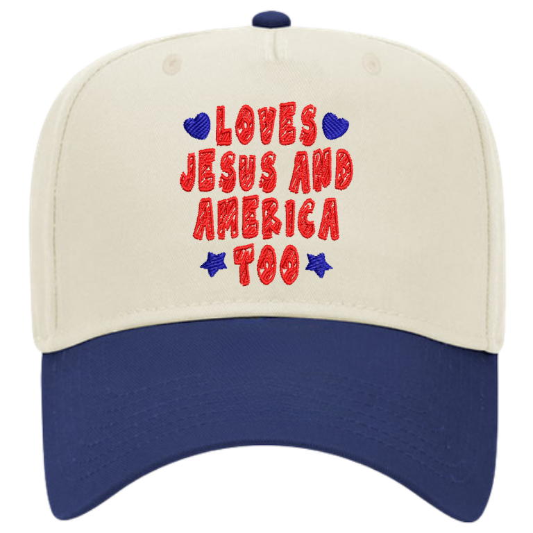 Loves Jesus and America Too embroidered patriotic hat with cream front, royal blue bill, red lettering, and blue hearts and stars.